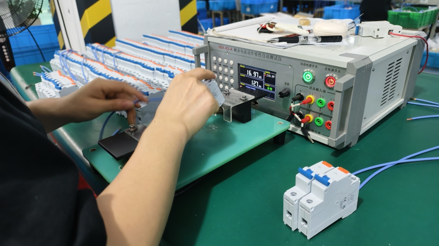 A single breaker on a bench tester during final inspection