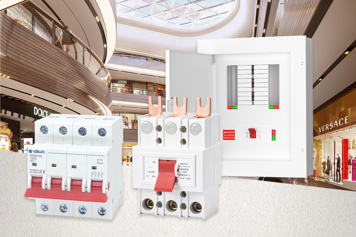 Commercial distribution range shown against a retail interior: a TP&N metal distribution board with its busbar and outgoing ways exposed, beside 100A main switches and a moulded-case switch disconnector