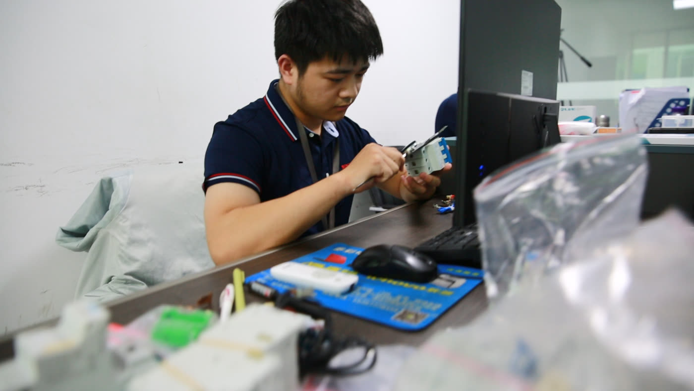 Engineer working on a prototype circuit breaker